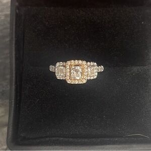 Three stone emerald cut silver and rose gold engagement right